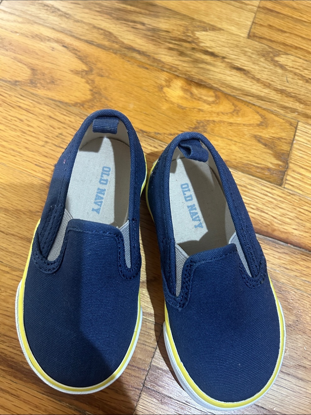 Never worn! Old Navy Navy Slip-On Canvas Shoes with Yellow Trim